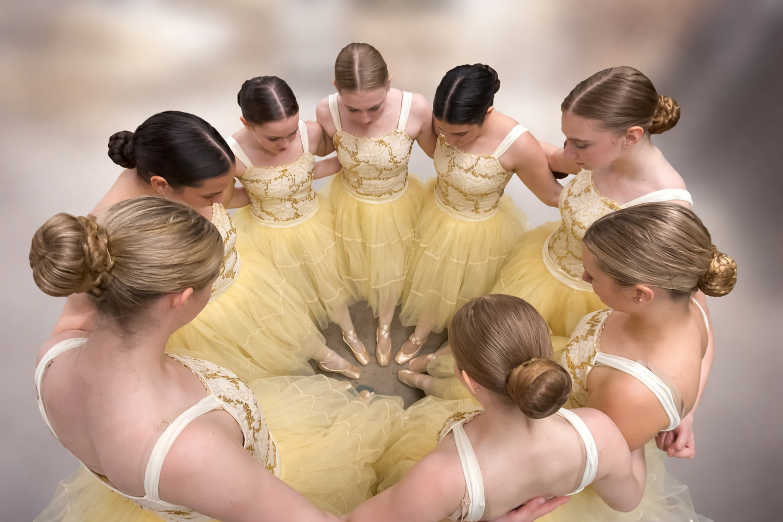 Dancers in yellow tutus overhead circle